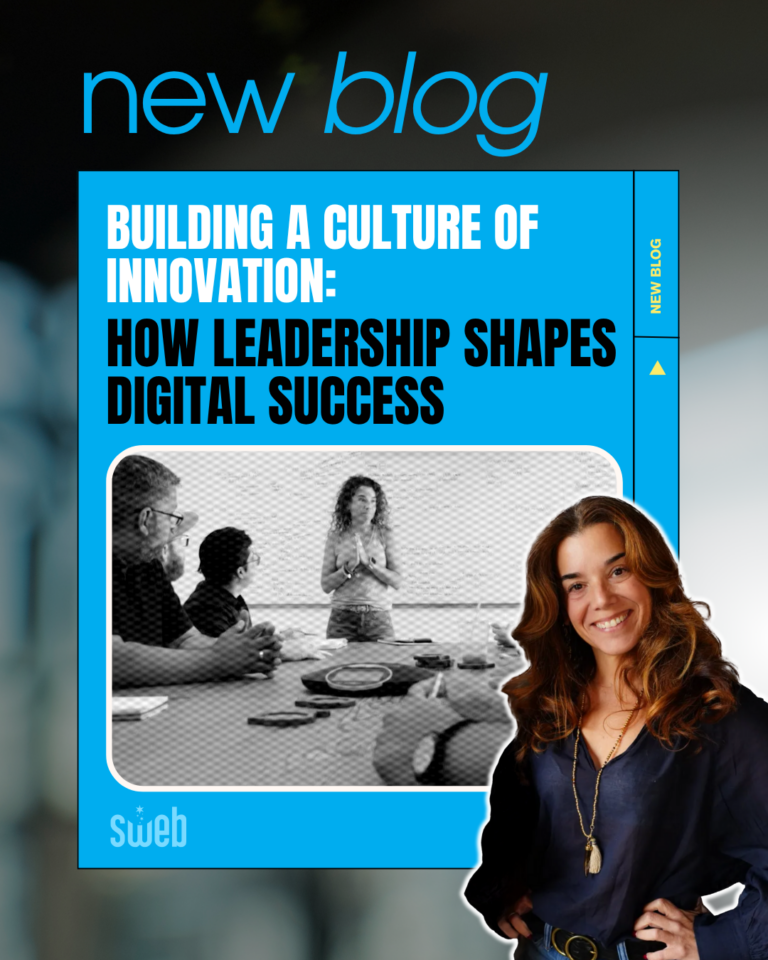 A team of creative professionals collaborate around a table in a bright, modern workspace. Laptops, notebooks, and coffee cups suggest an active brainstorming session. The atmosphere reflects a culture of trust, curiosity, and innovation — where diverse ideas are welcomed, and bold thinking is encouraged.