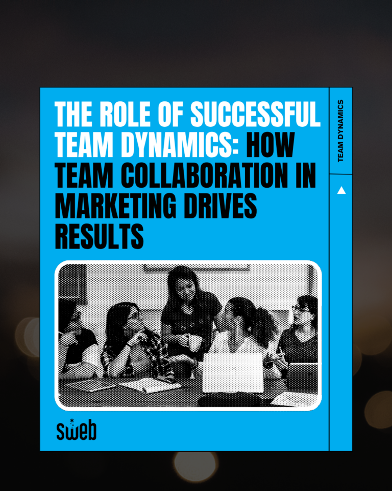 Sweb Development marketing team collaborating around a table, showcasing strong team dynamics and creative brainstorming.