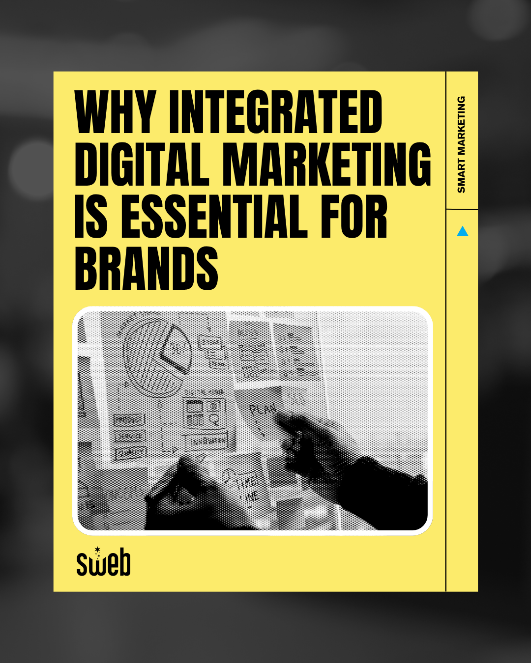 Hands creating a digital marketing plan with charts and notes, symbolizing integrated brand strategy